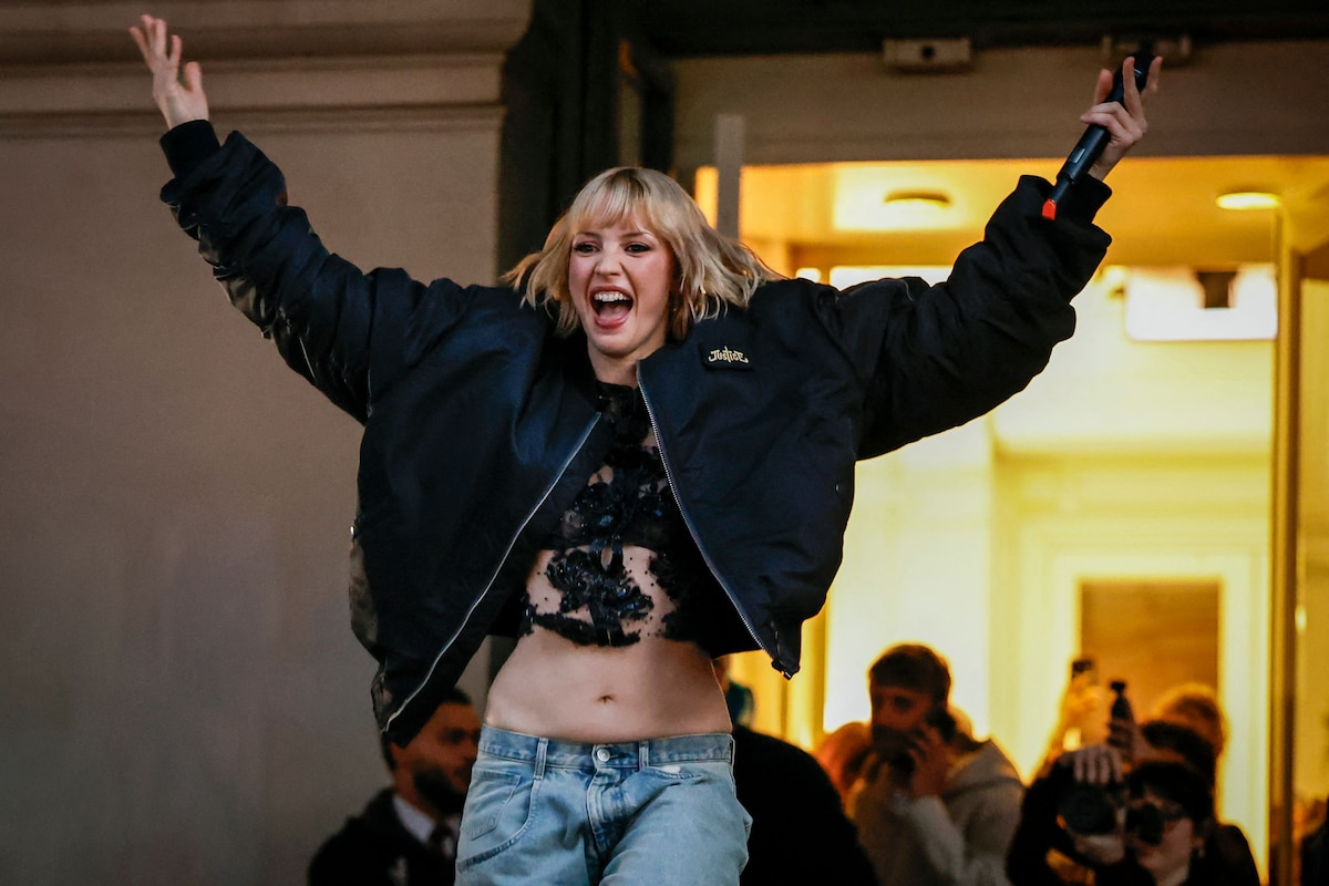 Belgian singer Angele appears on the square de la Monnaie in Brussels on February 26, 2026 to showcase on the eve of the release of her new song "What You Want". (Photo by SIMON WOHLFAHRT / AFP)